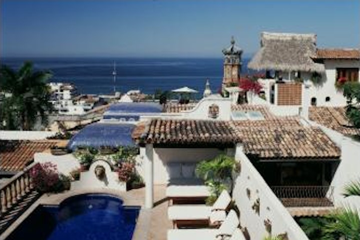 The Church of Guadalupe and Banderas Bay can be seen from the terrace of the San Miguel Presidential Suite at Hacienda San Angel.