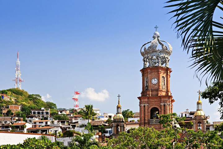Our Lady of Guadalupe Church and the rooftops of buildings in Old Town Puerto Vallarta create a charming view.