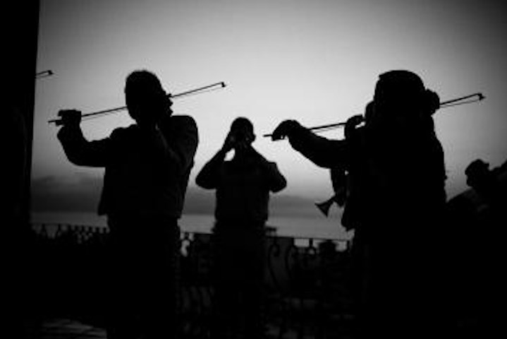 Black and White silhouette of mariachi band