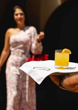 Amenities feature is a welcome drink being served to an arriving guest at Hacienda San Angel.
