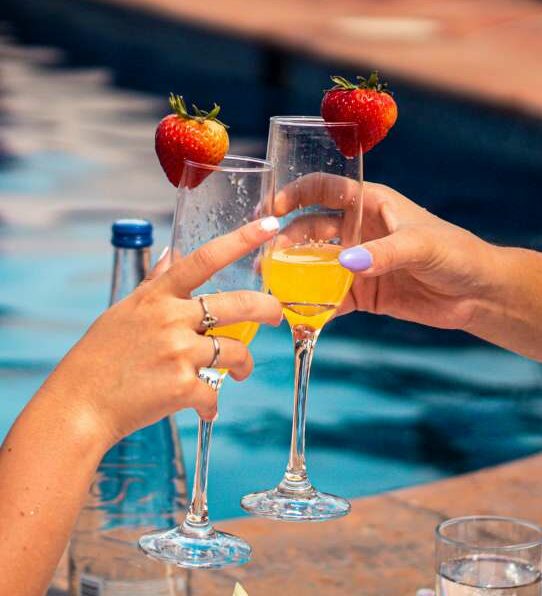 Bespoke Offers include Day Pass to Hacienda San Angel, friends drinking mimosas by the pool.
