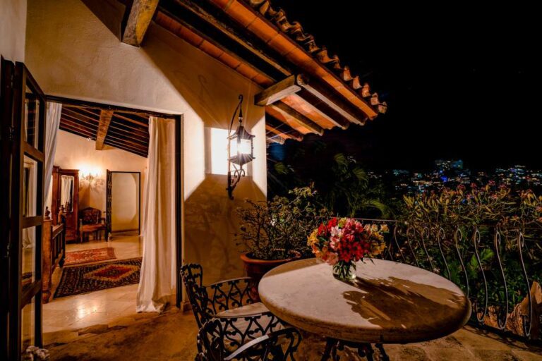 Private balcony and room at night.